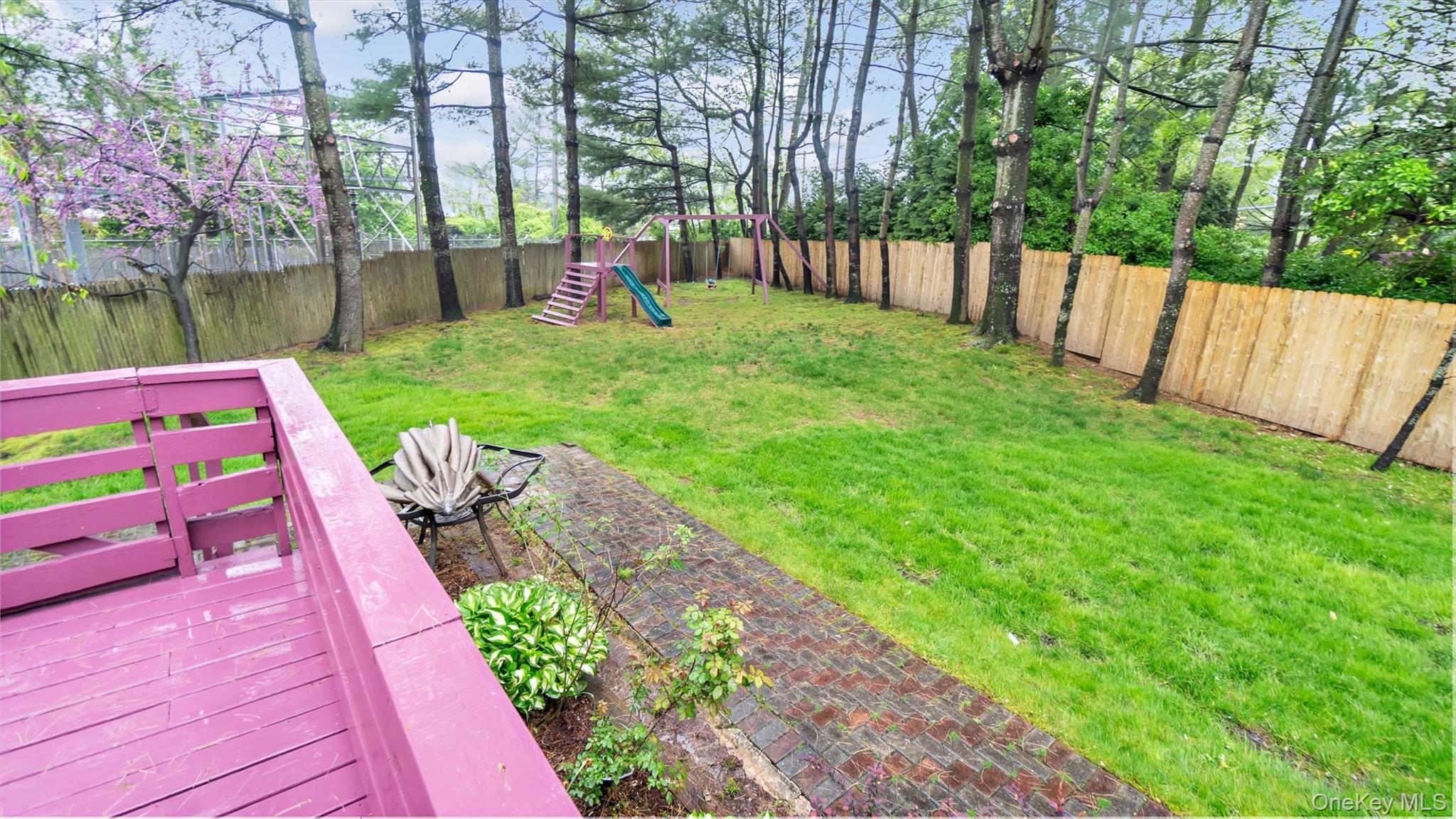 47 Carriage Road Roslyn, NY 11576 - Photo 29 of 31 View of yard featuring a fenced backyard