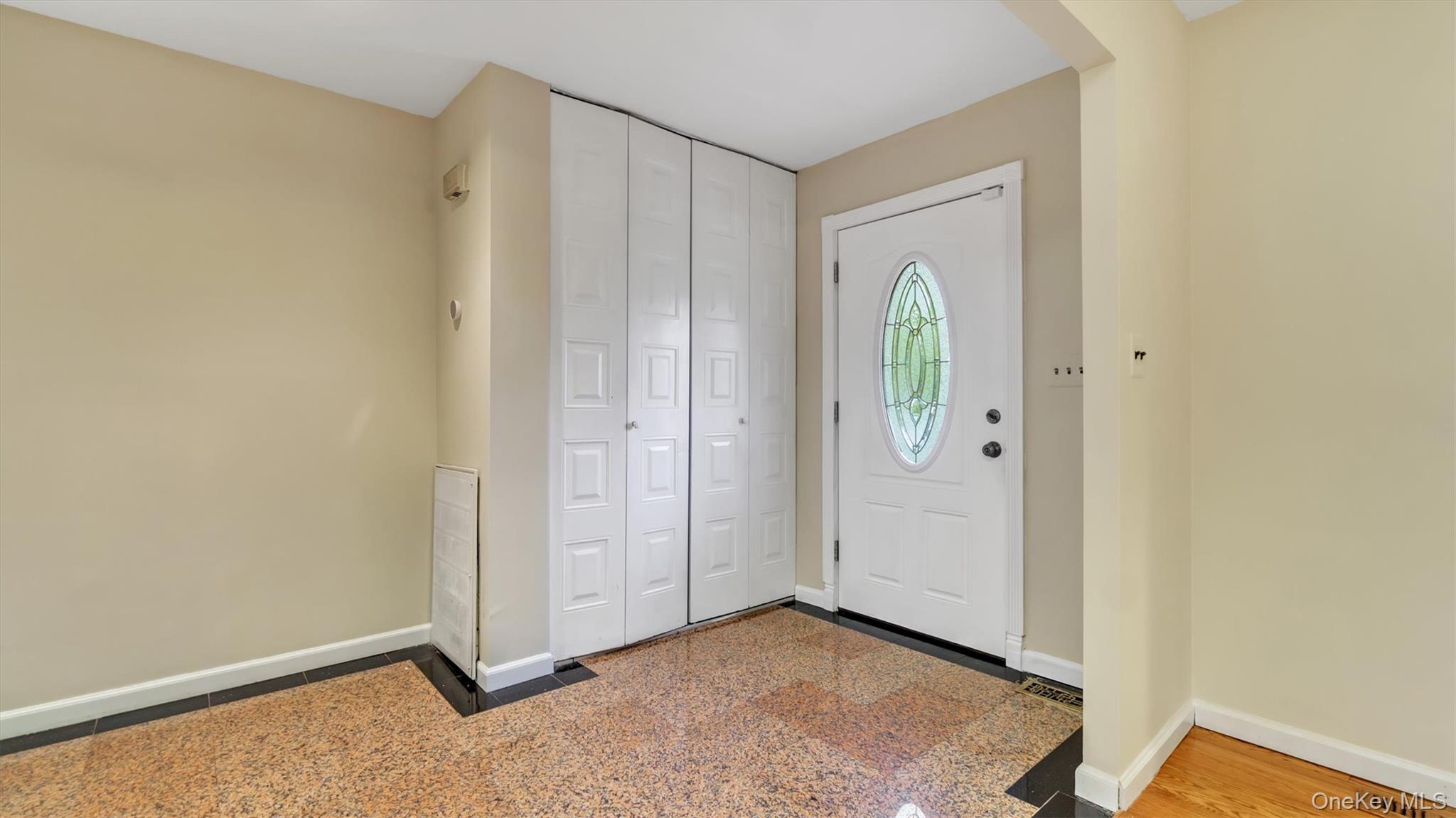 47 Carriage Road Roslyn, NY 11576 - Photo 4 of 31 Entryway with visible vents and baseboards