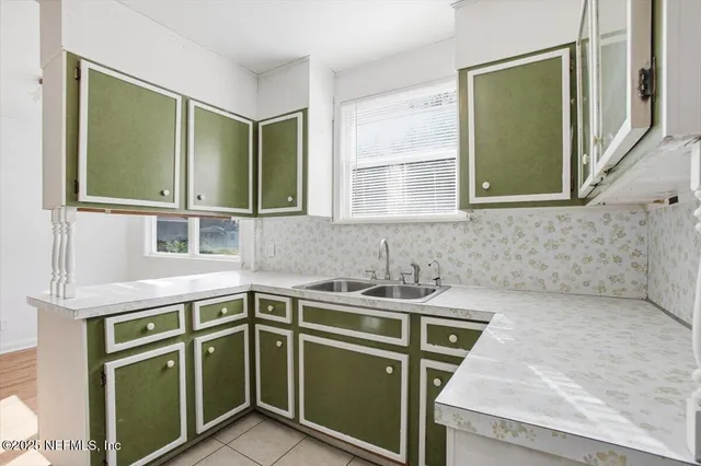 a kitchen with a sink and a window