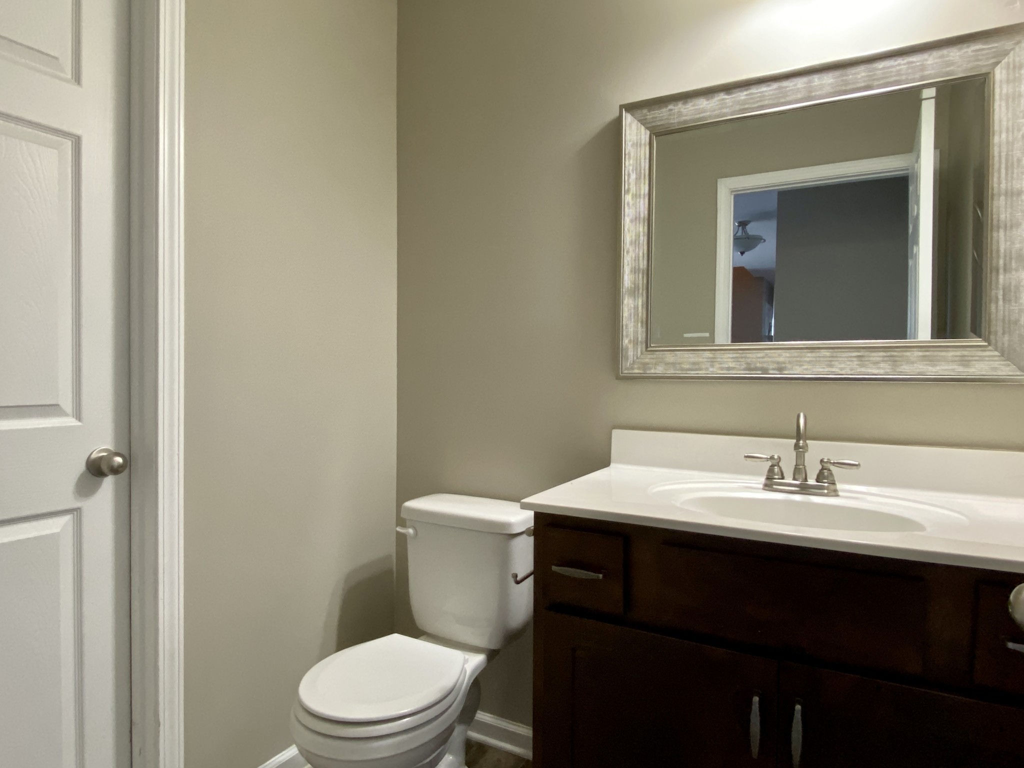 951 Hugh Hunter Road Oak Grove, KY 42262 - Photo 14 of 35 a bathroom with a sink a toilet and mirror