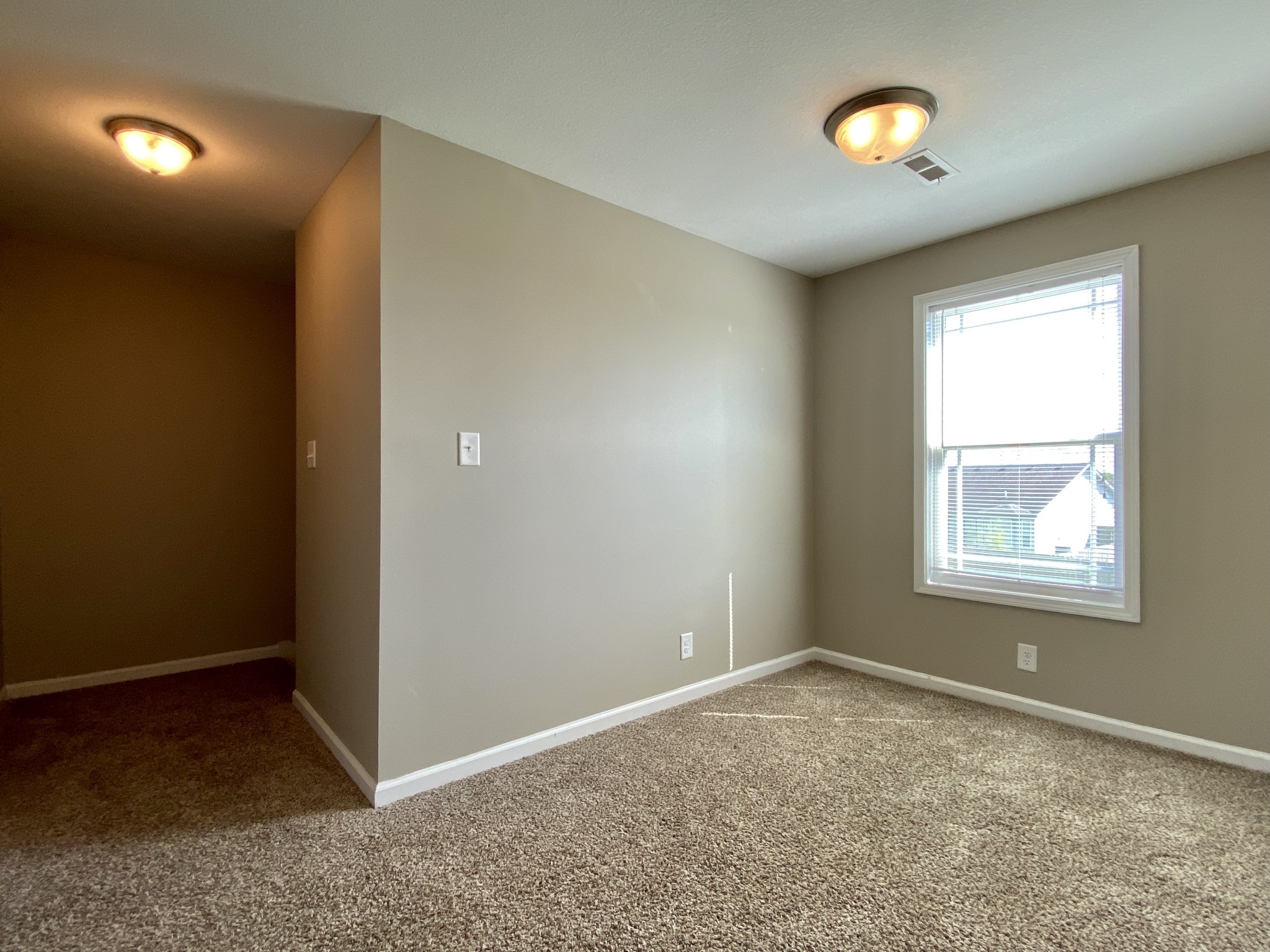 951 Hugh Hunter Road Oak Grove, KY 42262 - Photo 17 of 35 an empty room with windows