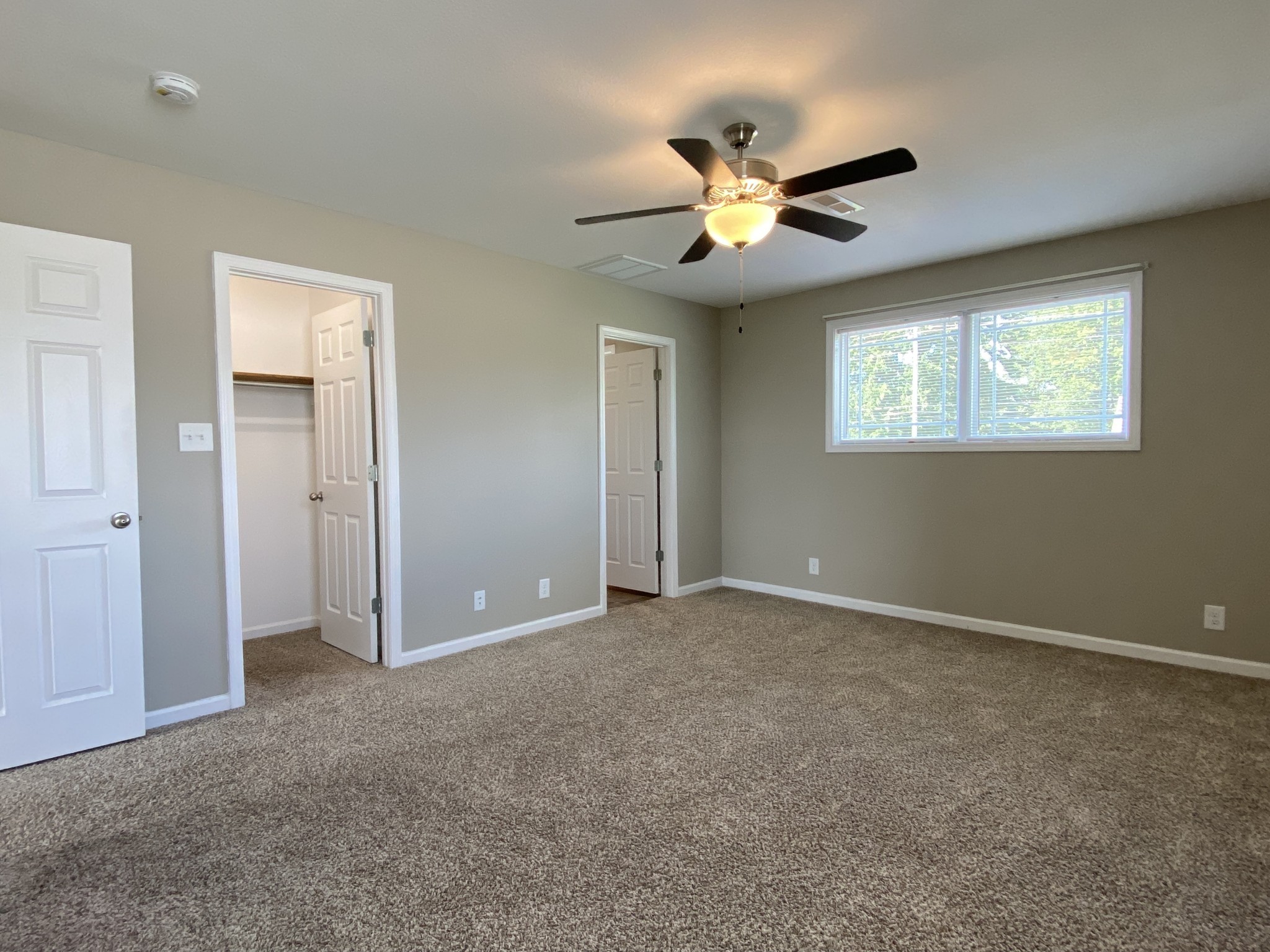 951 Hugh Hunter Road Oak Grove, KY 42262 - Photo 19 of 35 an empty room with windows and fan