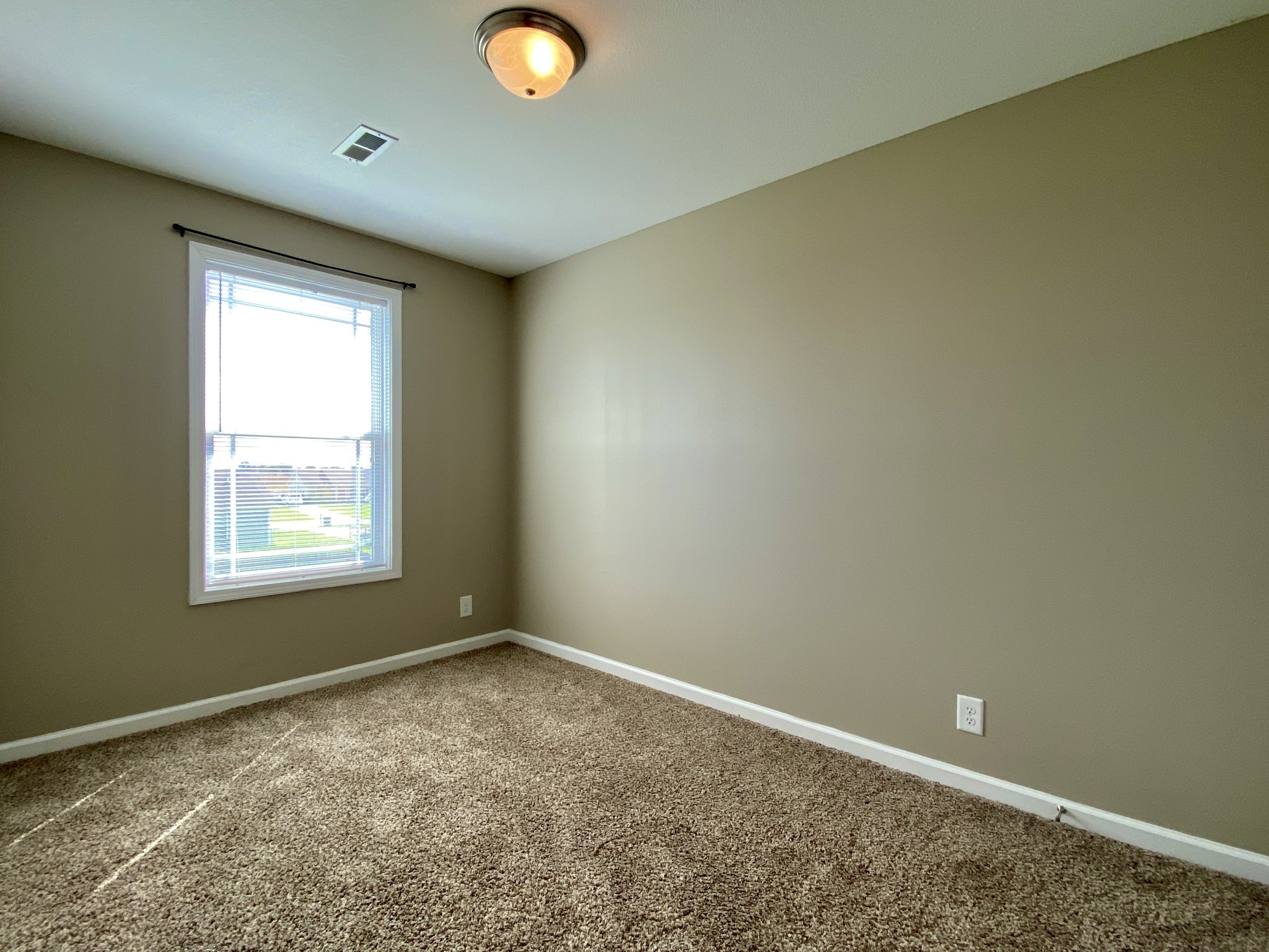 951 Hugh Hunter Road Oak Grove, KY 42262 - Photo 26 of 35 an empty room with a empty space and a window