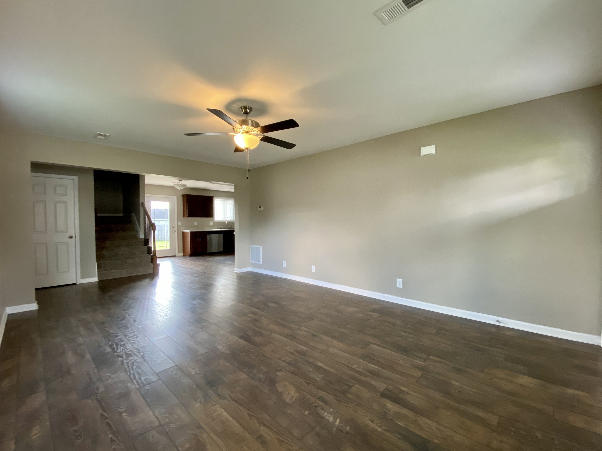 951 Hugh Hunter Road Oak Grove, KY 42262 - Photo 5 of 35 wooden floor in an empty room with a window