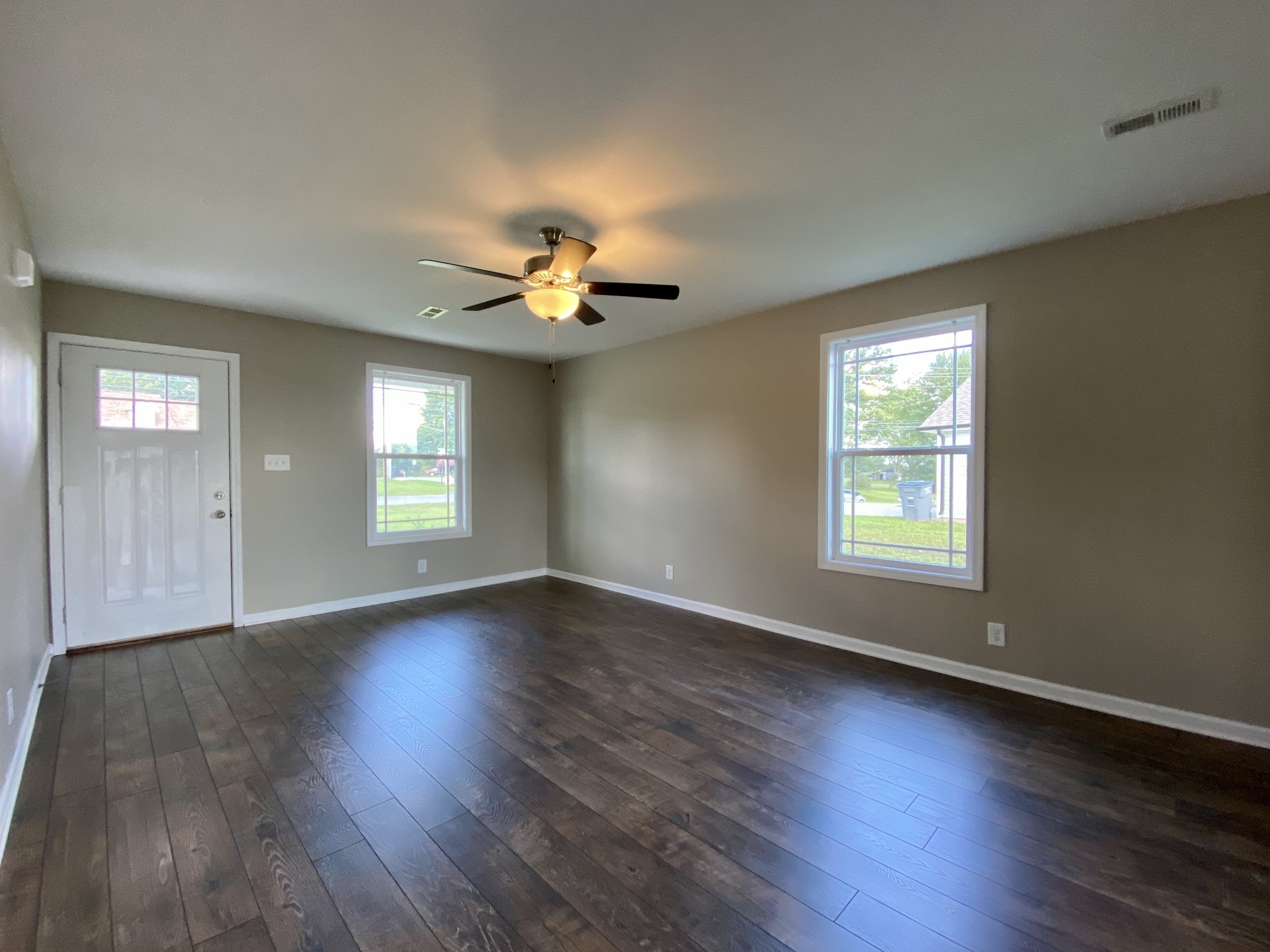 951 Hugh Hunter Road Oak Grove, KY 42262 - Photo 7 of 35 an empty room with wooden floor and window