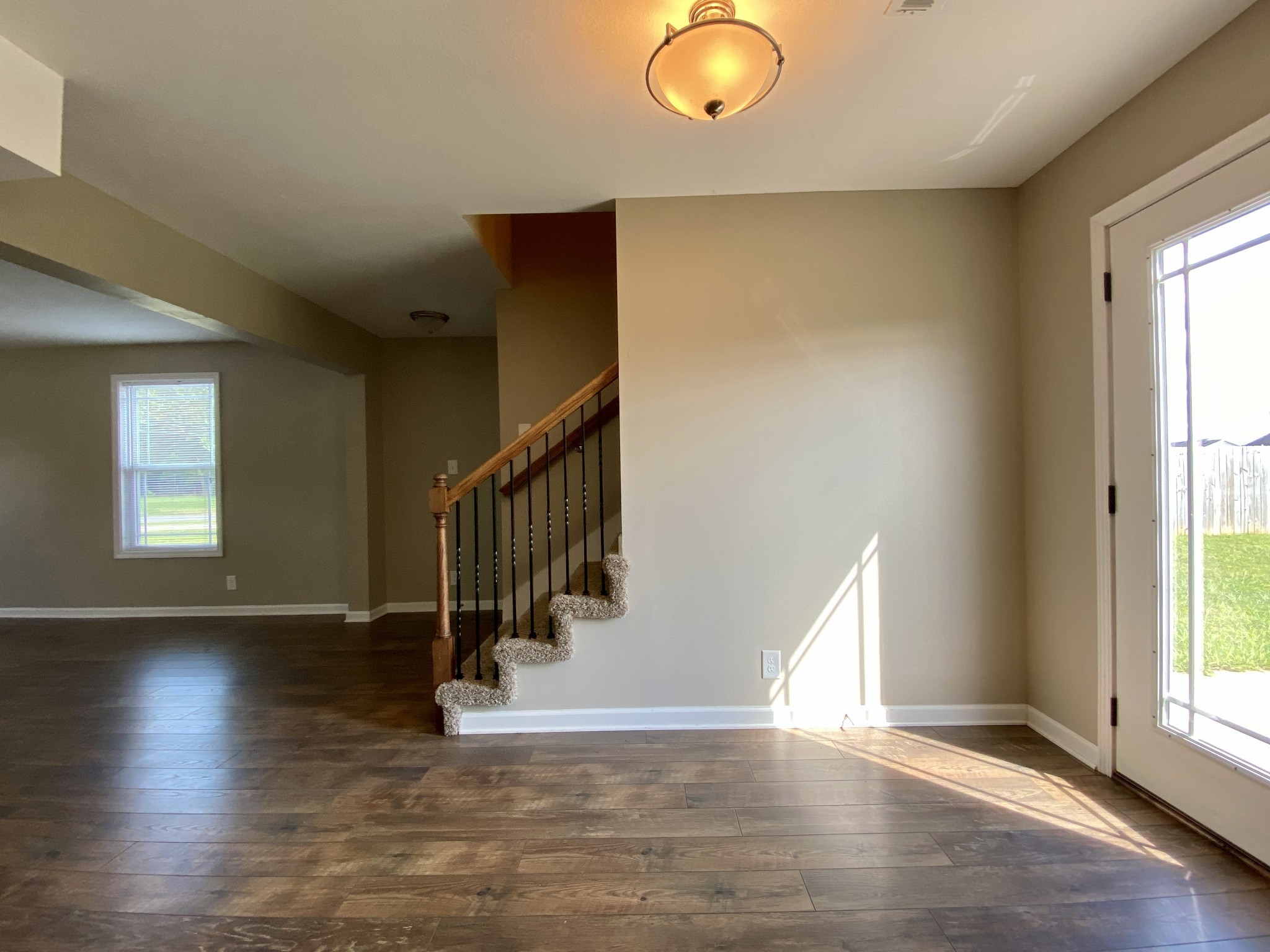 951 Hugh Hunter Road Oak Grove, KY 42262 - Photo 9 of 35 an entryway in a hall with wooden floor and a window