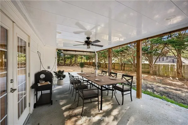 a view of a dining room with furniture wooden floor and chandelier
