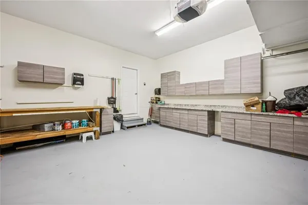 a view of a garage with furniture and toys
