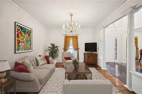 a living room with fireplace furniture and a flat screen tv