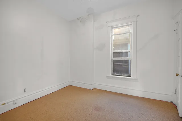 a white bath tub sitting next to a white toilet and sink