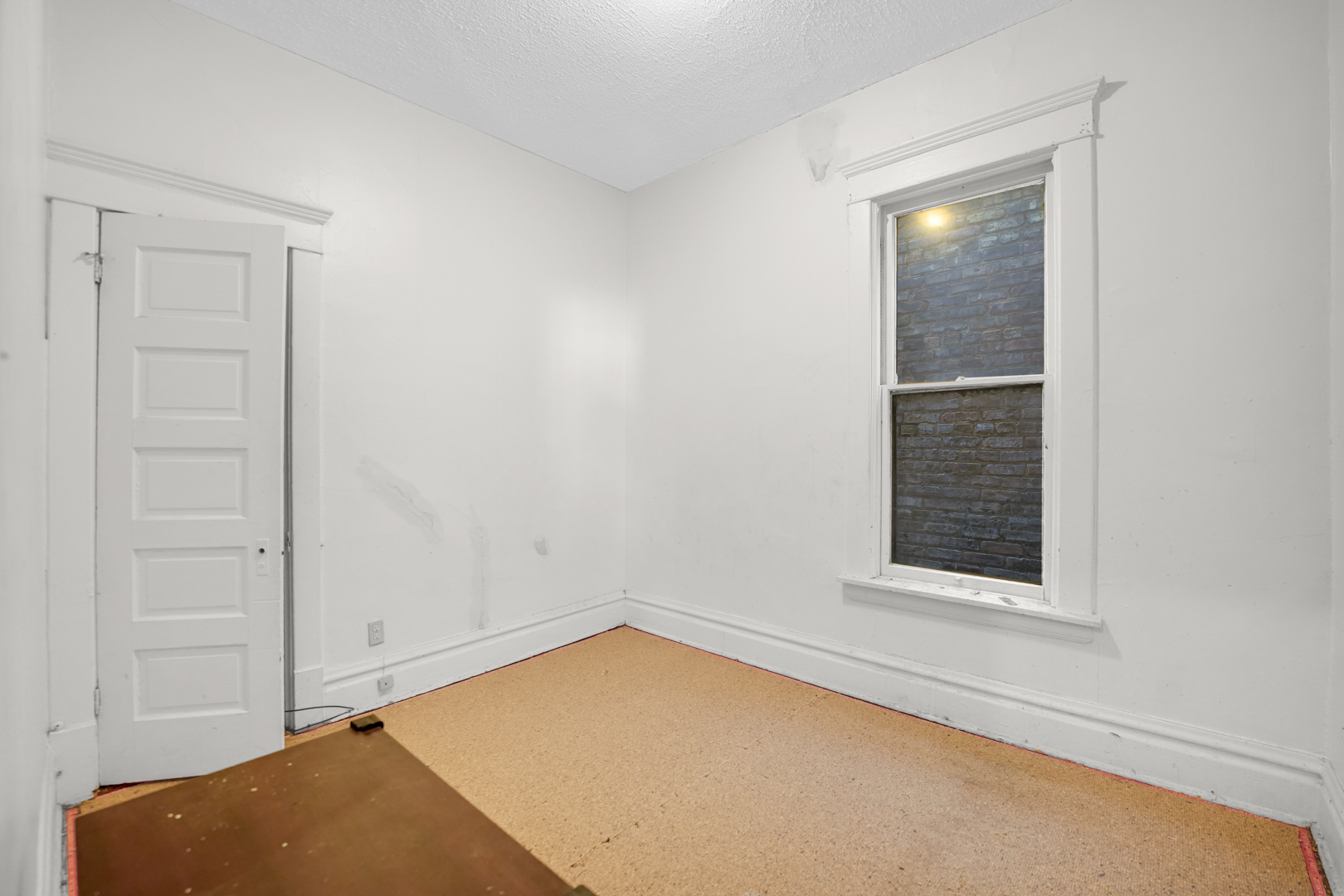 6045 South Peoria Street Chicago, IL 60621 - Photo 18 of 25 a view of an empty room and window