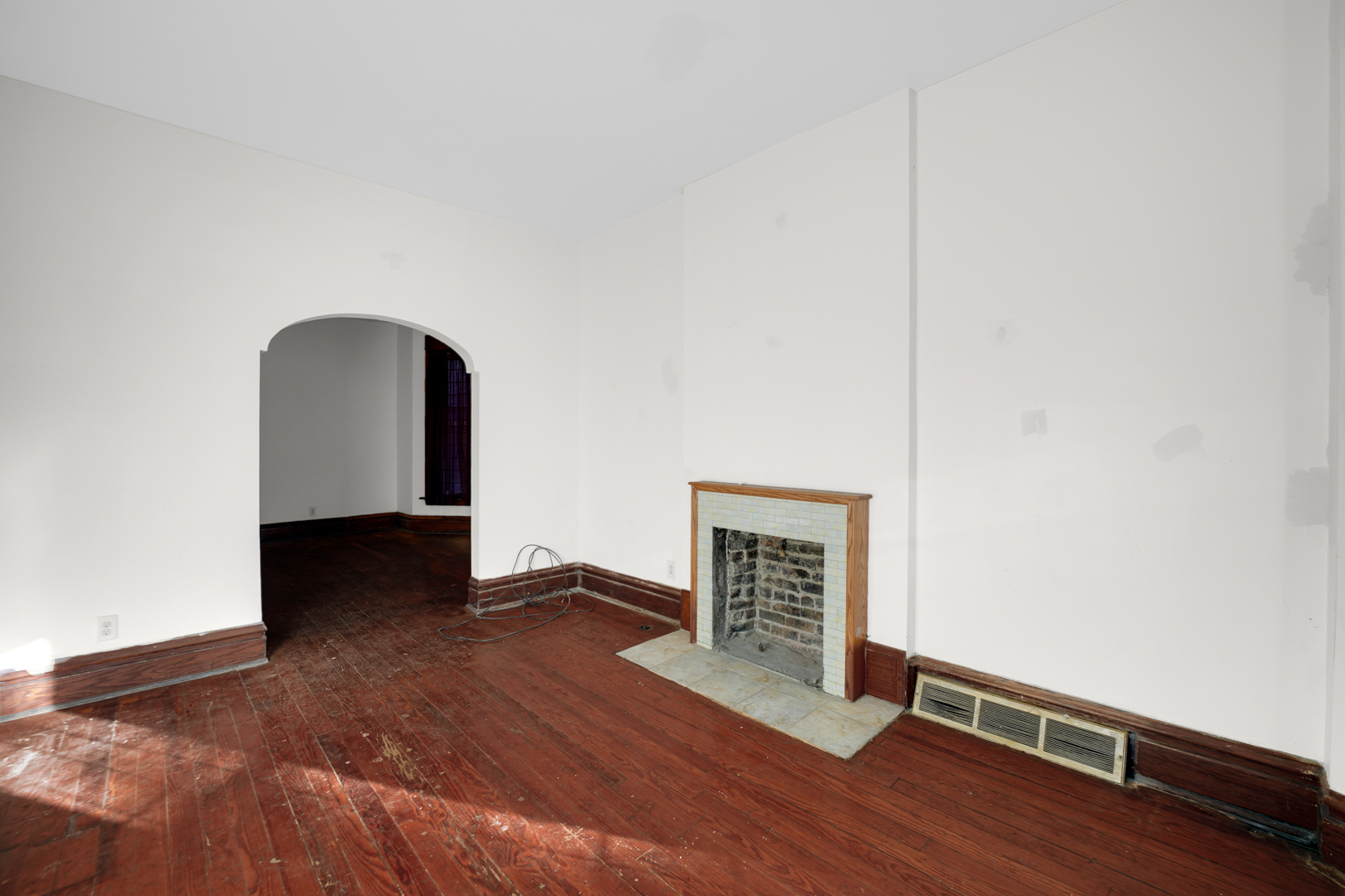 6045 South Peoria Street Chicago, IL 60621 - Photo 19 of 25 a view of an empty room with wooden floor