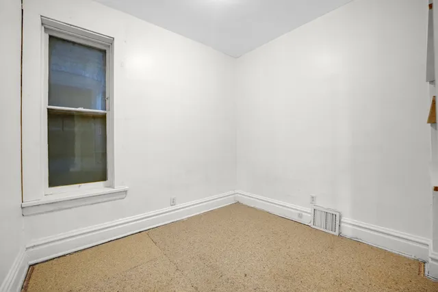 a view of a room with a large window