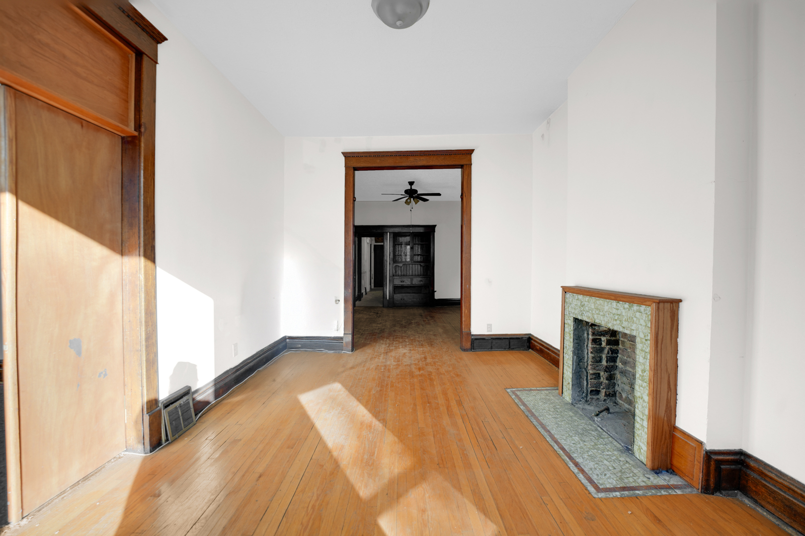 6045 South Peoria Street Chicago, IL 60621 - Photo 9 of 25 a view of an empty room with a fireplace