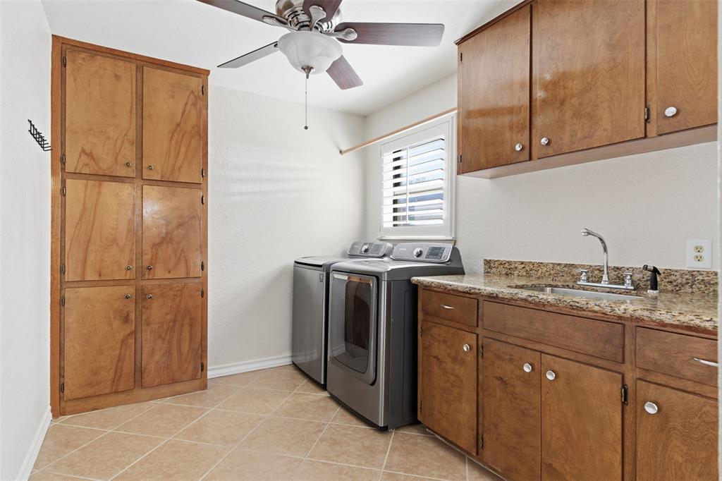 116 Cromeans Street Jacksboro, TX 76458 - Photo 13 of 32 a kitchen with stainless steel appliances granite countertop cabinets and window