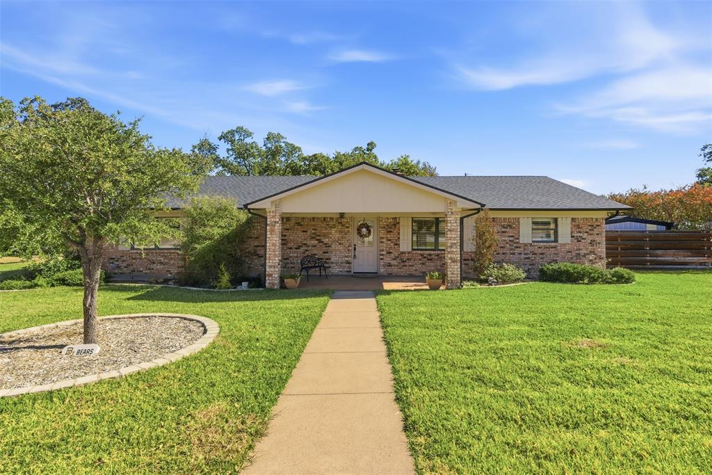 116 Cromeans Street Jacksboro, TX 76458 - Photo 2 of 32 a front view of a house with a yard