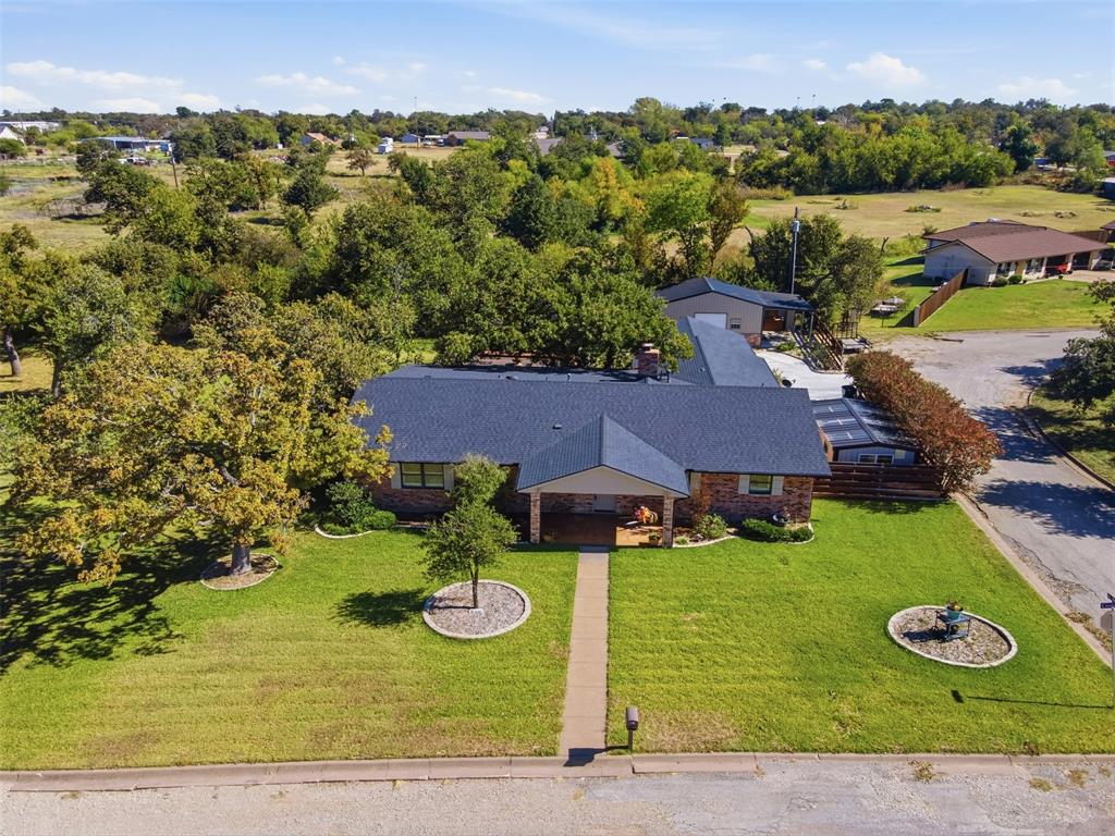 116 Cromeans Street Jacksboro, TX 76458 - Photo 30 of 32 an aerial view of a house with garden space and outdoor space