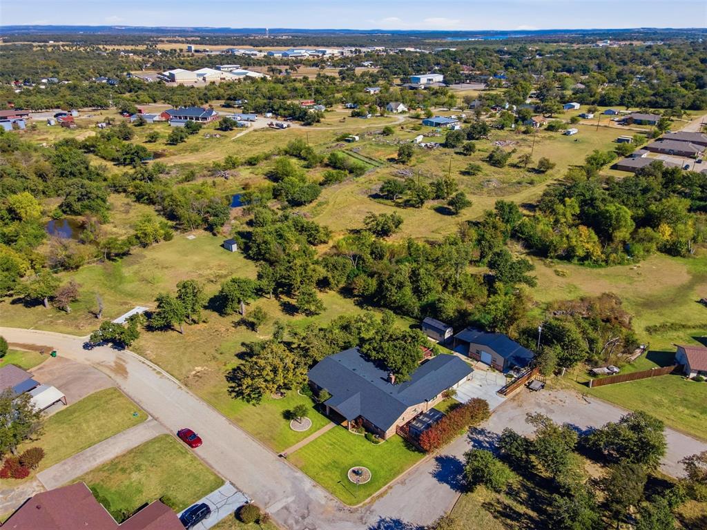 116 Cromeans Street Jacksboro, TX 76458 - Photo 32 of 32 an aerial view of residential houses with outdoor space