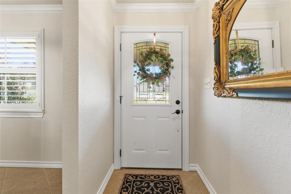 116 Cromeans Street Jacksboro, TX 76458 - Photo 6 of 32 a view of a hallway with wooden floor and a dining room