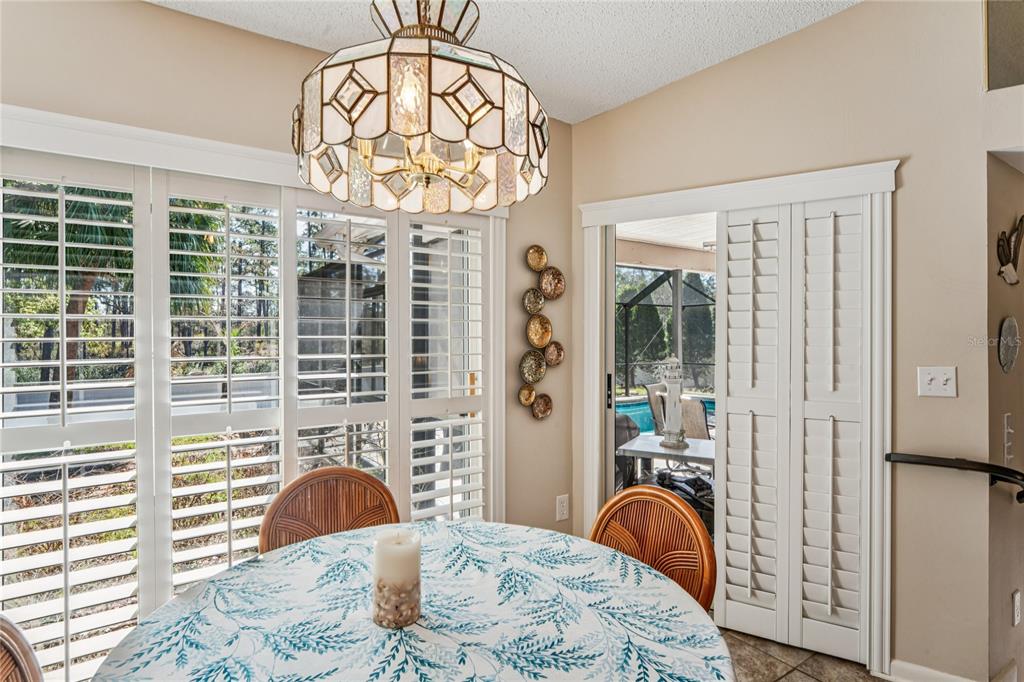 6324 India Drive Spring Hill, FL 34608 - Photo 20 of 68 a bedroom with a bed and a chandelier