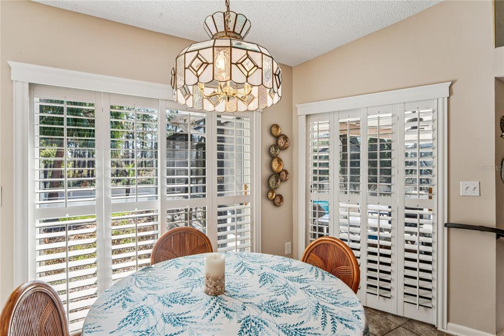 6324 India Drive Spring Hill, FL 34608 - Photo 23 of 68 a view of a dining room with furniture window and outside view