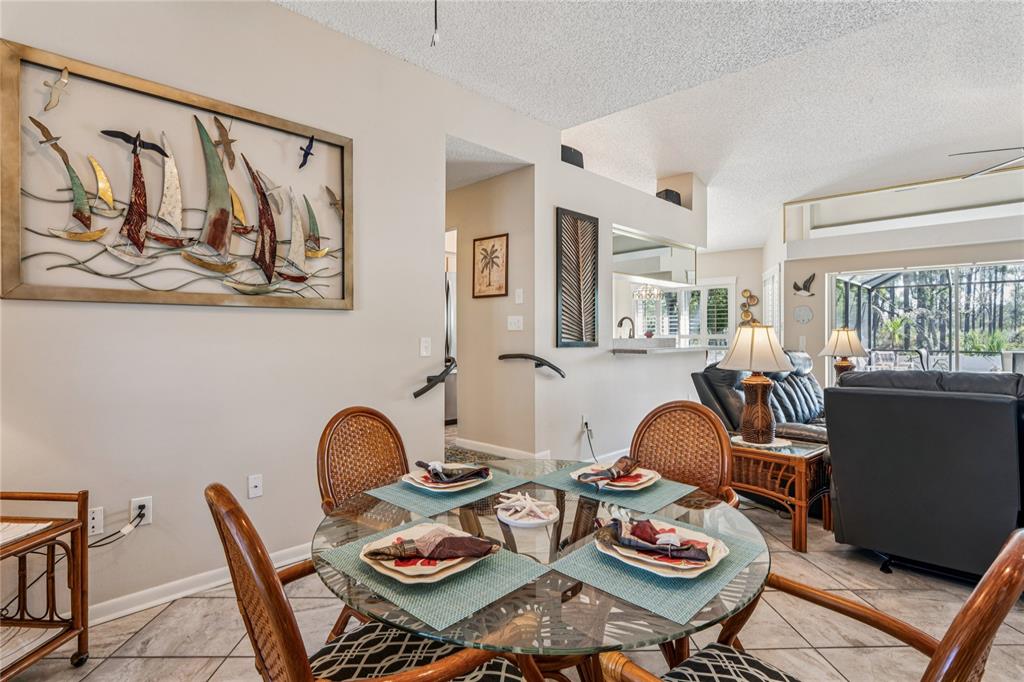 6324 India Drive Spring Hill, FL 34608 - Photo 26 of 68 a living room with furniture and floor to ceiling windows
