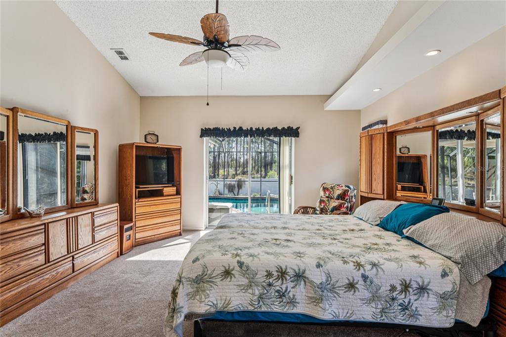 6324 India Drive Spring Hill, FL 34608 - Photo 28 of 68 a bedroom with a large bed and a large window