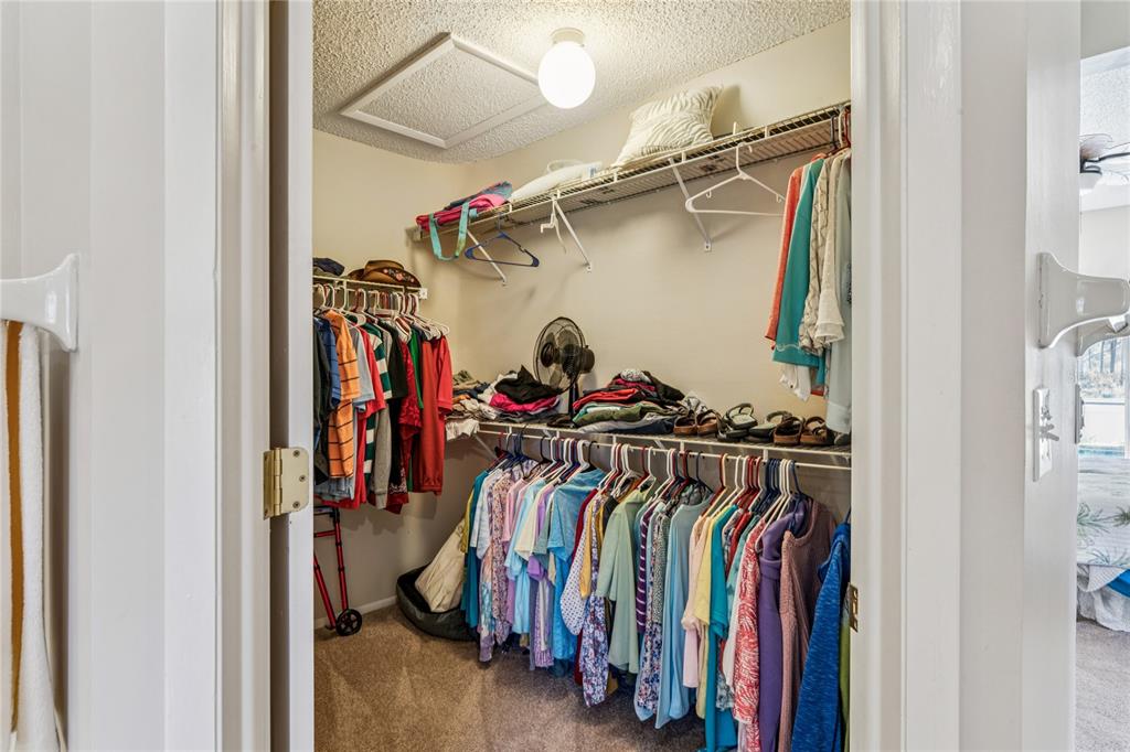 6324 India Drive Spring Hill, FL 34608 - Photo 34 of 68 a view of walk in closet with clothes