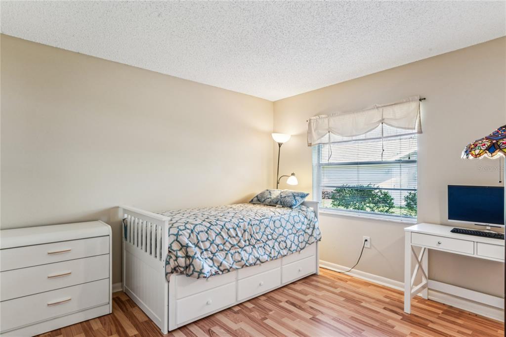 6324 India Drive Spring Hill, FL 34608 - Photo 35 of 68 a bedroom with a bed and a flat screen tv