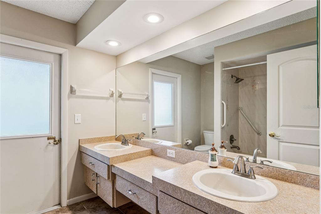 6324 India Drive Spring Hill, FL 34608 - Photo 38 of 68 a bathroom with a sink double vanity and a mirror
