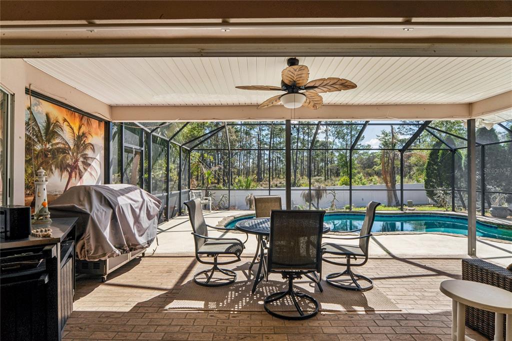 6324 India Drive Spring Hill, FL 34608 - Photo 46 of 68 a living room with large windows