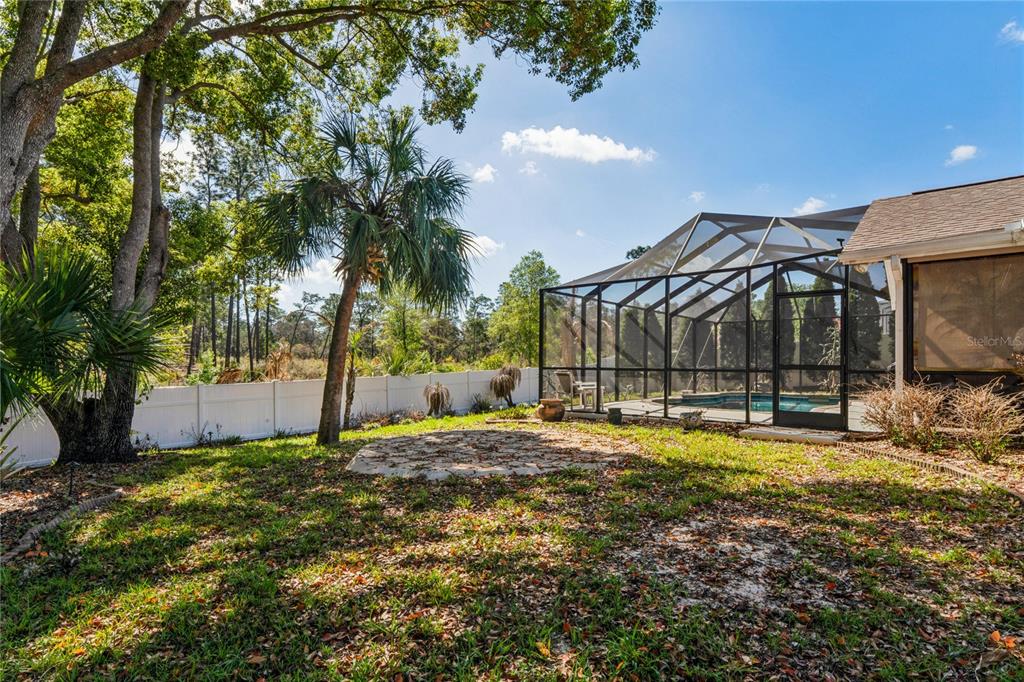 6324 India Drive Spring Hill, FL 34608 - Photo 54 of 68 a view of a house with yard and sitting area