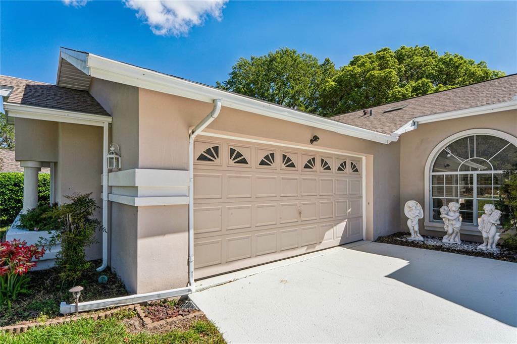 6324 India Drive Spring Hill, FL 34608 - Photo 58 of 68 a front view of a house with garage