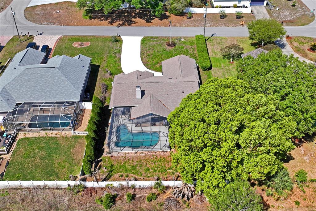 6324 India Drive Spring Hill, FL 34608 - Photo 63 of 68 an aerial view of multiple houses with yard
