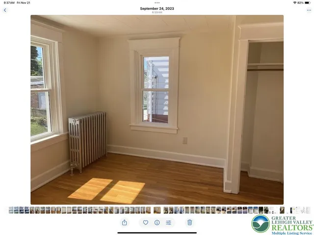 a room with a window and wooden floor