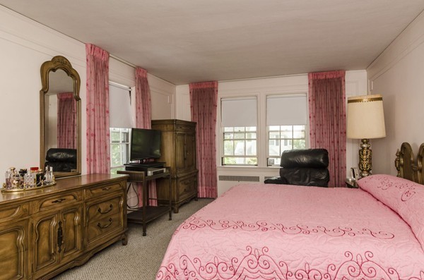 348 Russett Road Brookline, MA 02467 - Photo 13 of 18 a bedroom with a bed television and a window