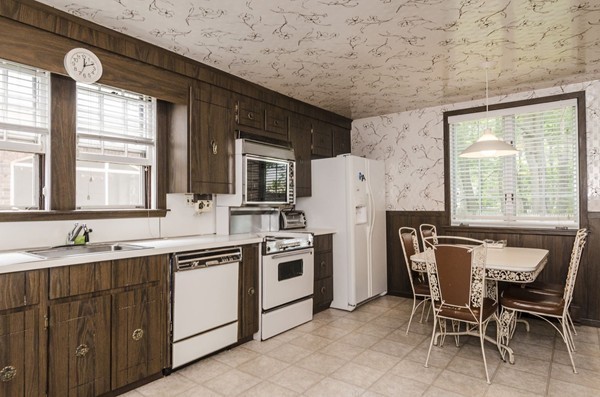 348 Russett Road Brookline, MA 02467 - Photo 9 of 18 a kitchen with a sink cabinets and window