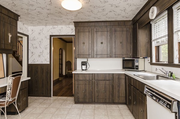 348 Russett Road Brookline, MA 02467 - Photo 10 of 18 a kitchen with a sink and cabinets