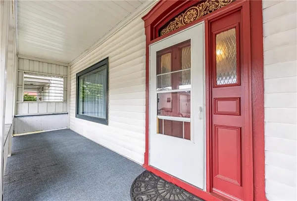 a view of a hallway with a dining room