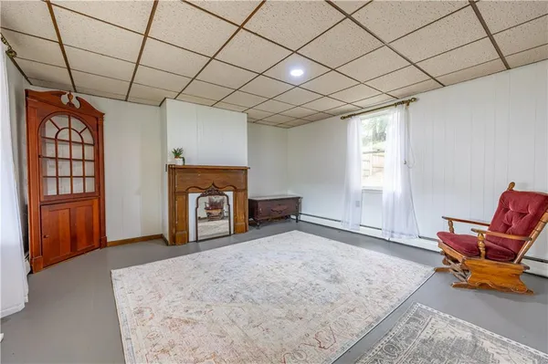 a view of a livingroom with furniture and a fireplace