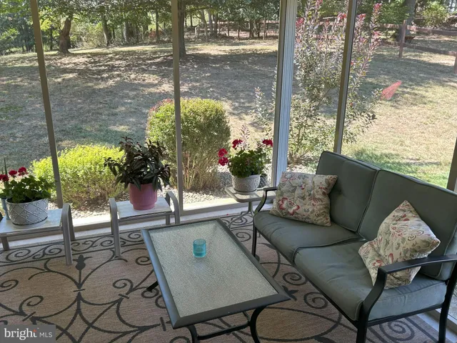a view of a house with yard and a garden