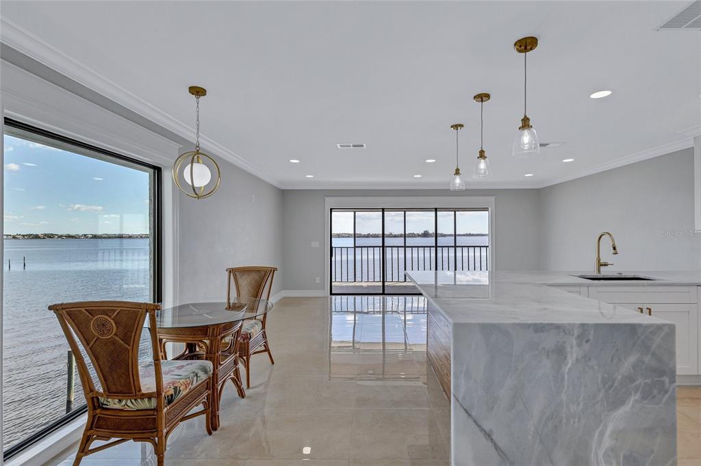 4403 7th Street East, Unit 4 Ellenton, FL 34222 - Photo 11 of 25 a dining room with furniture and window