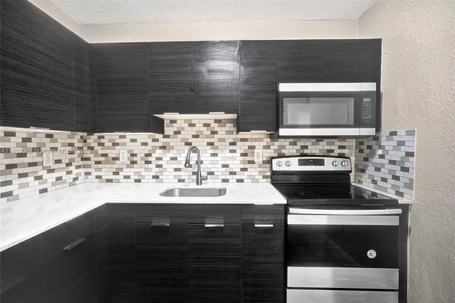 a bathroom with a sink and a stove