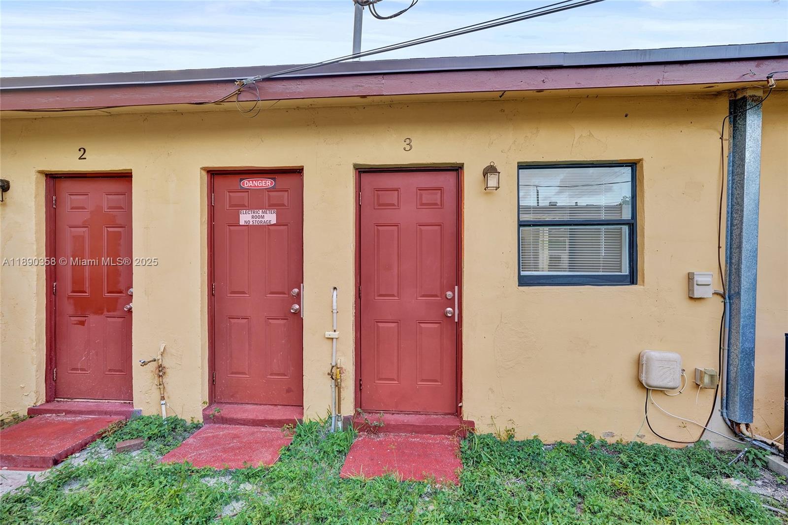 2731 Northwest 1st Street, Unit 3 Pompano Beach, FL 33069 - Photo 18 of 20 a front view of a house with yard