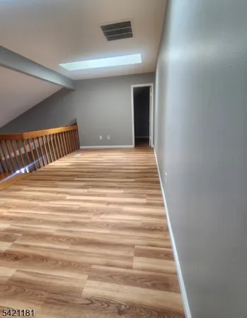 a view of a hallway with stairs