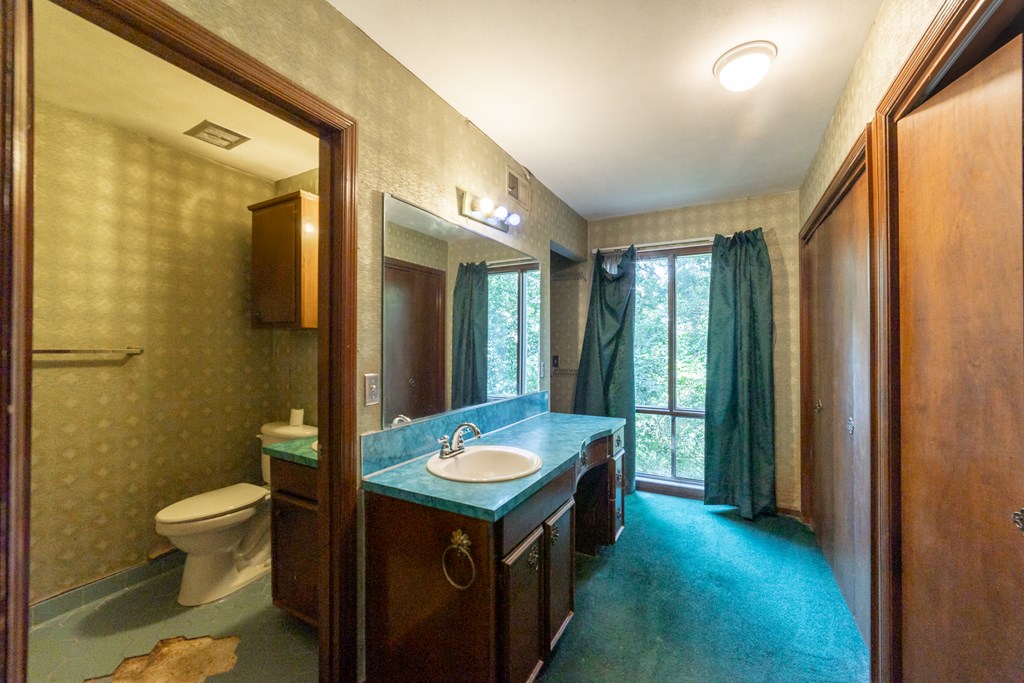 2724 Edgewood Road Columbus, GA 31906 - Photo 13 of 22 a bathroom with a sink a toilet and shower