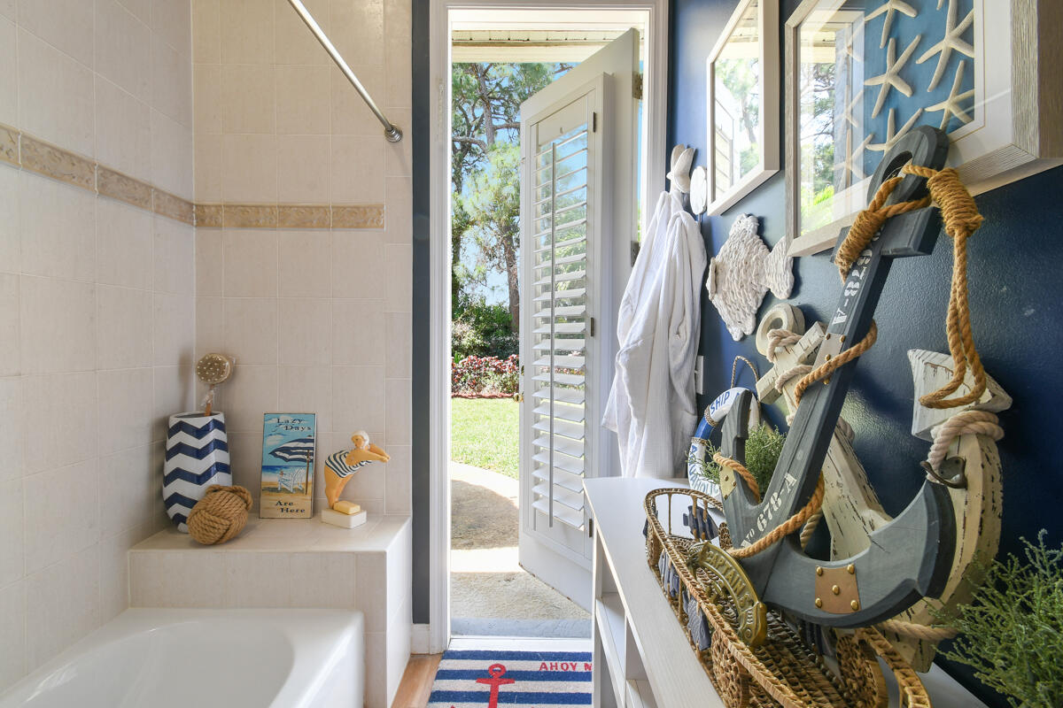 7831 Southeast Windjammer Way Hobe Sound, FL 33455 - Photo 38 of 80 a view of walk in closet with clothes and shoes