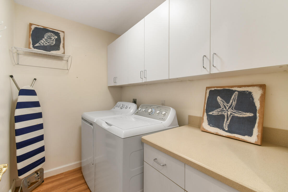 7831 Southeast Windjammer Way Hobe Sound, FL 33455 - Photo 44 of 80 a utility room with dryer and washer