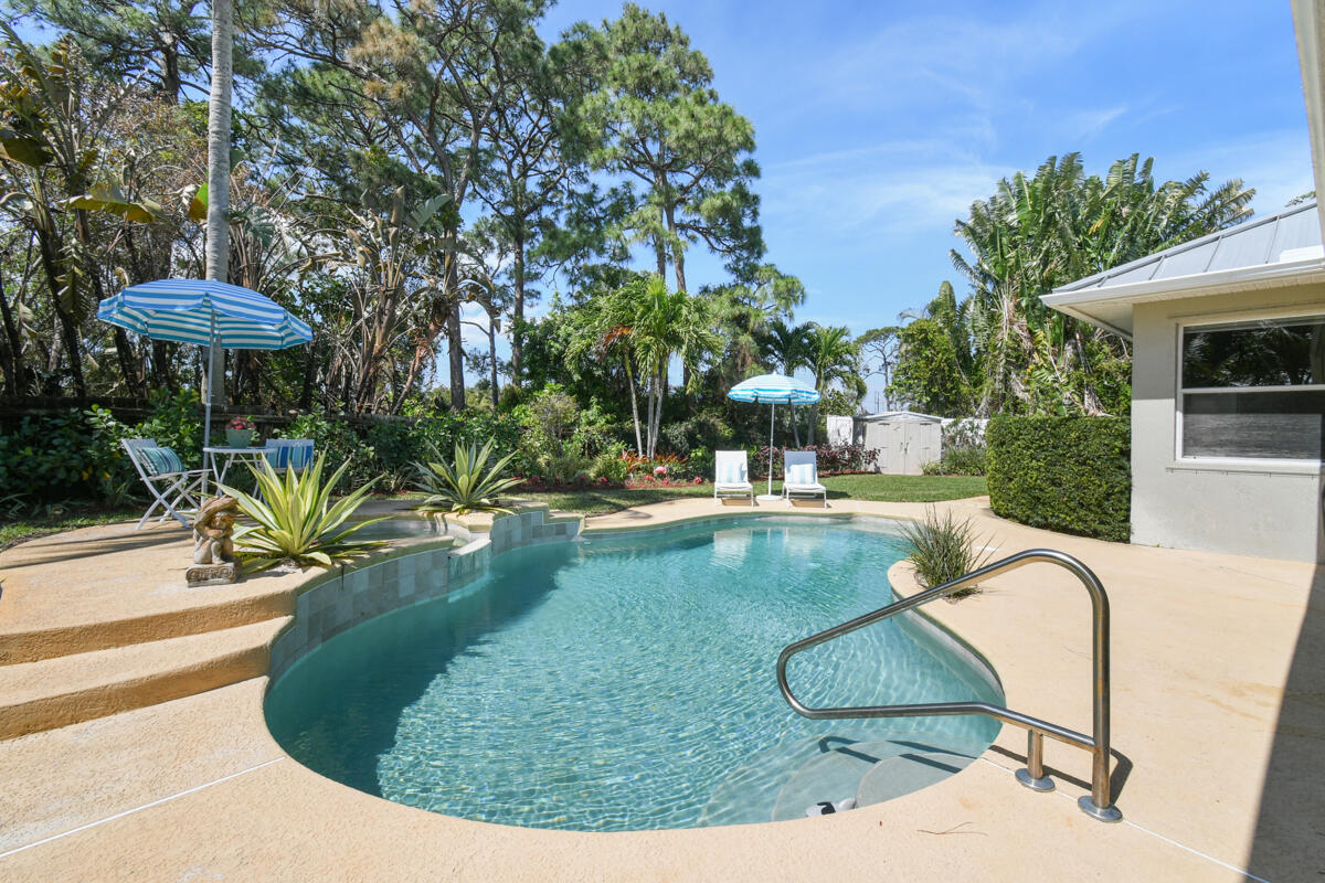 7831 Southeast Windjammer Way Hobe Sound, FL 33455 - Photo 51 of 80 a view of a swimming pool with a patio