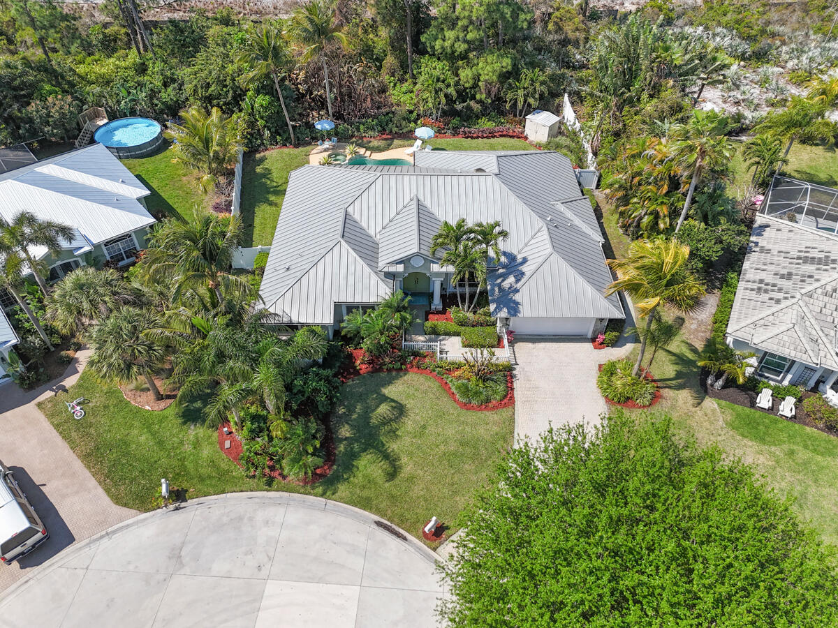 7831 Southeast Windjammer Way Hobe Sound, FL 33455 - Photo 73 of 80 an aerial view of a house with yard swimming pool and outdoor seating